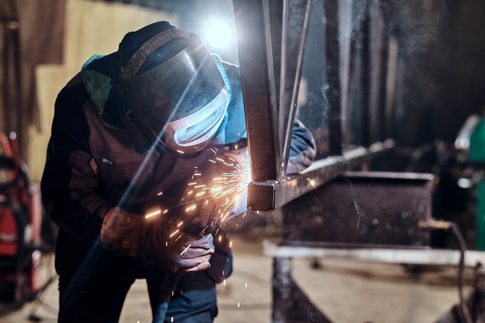 A welder at work in a metalworking shop